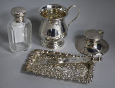 A George V silver capstan inkwell, a christening mug, a pin tray, a paper knife and a Waterman's