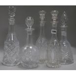 A pair of cut glass decanters and three others