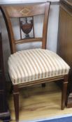 A pair of French Empire brass inset mahogany salon chairs