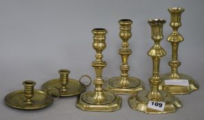 Four candlesticks and a pair of taper sticks