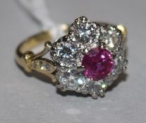 A Victorian style 18ct gold, ruby and diamond cluster ring, with diamond set shoulders, size K.
