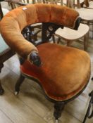 A Victorian carved oak tub chair