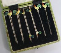 A set of ten sterling silver and enamel cocktail sticks with cockerel terminals.