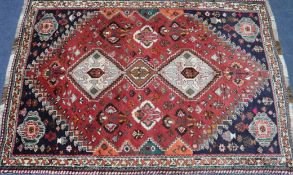 A Persian red ground rug, 178 x 124cm