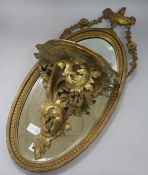 A gilt mirror and a bracket