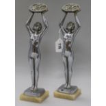 A pair of Art chrome plated figures of ladies, signed Limousin