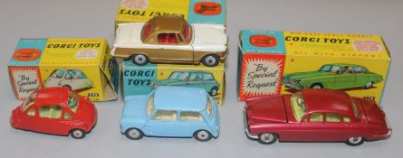 A Corgi Toys Jaguar Mark X No. 238 (cerise) and three other boxed Corgi cars, including Triumph