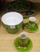 A Poole pottery green ground large dish, no 5, three smaller dishes, a bowl and two small vases