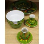 A Poole pottery green ground large dish, no 5, three smaller dishes, a bowl and two small vases