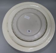 Three 18th century creamware dishes and an 18th century saltglaze stoneware plate