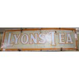 A large Lyon's Tea enamel sign