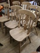 A set of six beech solid seat kitchen chairs.