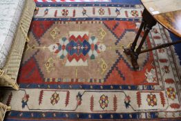 A Caucasian brown ground rug, 212 x 167cm