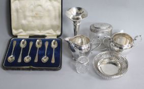 A pair of silver bonbon dishes, a silver cream and sugar, two silver mounted jars, a silver dish,