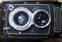 A cased Rolleicord camera