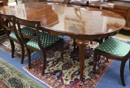 A 1930's mahogany extending dining table, plus two leaves W.152cm