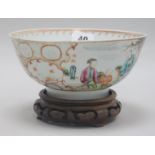 An 18th century Chinese famille rose bowl, wood stand