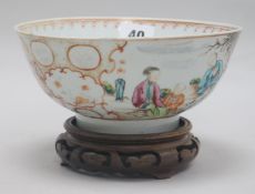 An 18th century Chinese famille rose bowl, wood stand