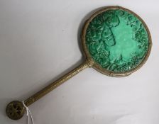 A carved malachite hand mirror