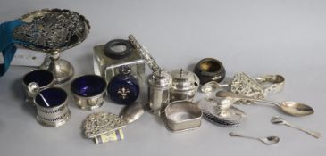 A group of mixed silver including condiments, napkin rings, scents, belt buckles etc.