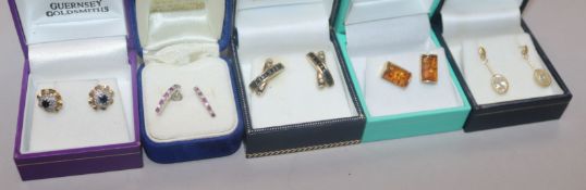 Five pairs of assorted gold and gem set earrings.