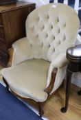 A Victorian oak spoonback armchair