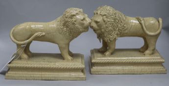 A pair of stoneware lions