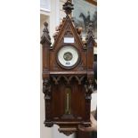A late 18th century French gothic design carved walnut aneroid barometer and thermometer H.76cm