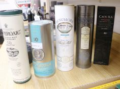 Five assorted bottles of whisky: Bruichladdich, Bowmore, Murray McDavid Bunnahabhain 1996, Laphroaig