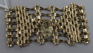 A 9ct gold broad fancy link bracelet.