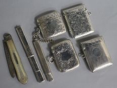Four early 20th century engraved silver vesta cases, two silver pencil holders and a Victorian