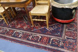 A red ground carpet, 302cm x 200cm