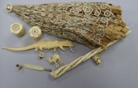 A yellow-metal mounted miniature ivory necessaire, an ivory-handled parasol and seven other ivory