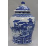 A late 19th century Chinese blue and white lidded baluster vase