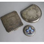 A Russian style enamelled white metal compact and two other compacts