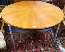 A modern circular starburst dining table, Diam. 117cm
