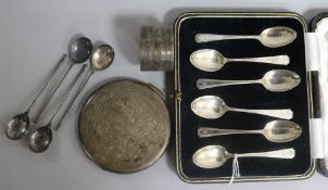 A cased set of six Art Deco silver teaspoons, an Egyptian silver compact, a silver napkin ring and