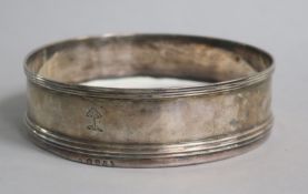 A George III silver wine coaster, London, 1796, with later base, 12.5cm.