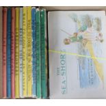 A collection of 16 Ladybird books and seven albums of tea and cigarette cards, the Ladybird books