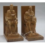 A pair of walnut and boxwood bookends formed as Cervantes and Shakespeare