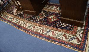 A Caucasian rug, (worn), 225 x 108cm