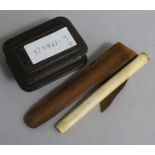 A Trick Opening stamp box and an ivory cigarette holder