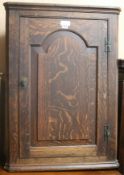 A George III oak corner cupboard, W.65cm