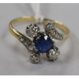 An early 20th century gold, sapphire and diamond dress ring, with diamond set shoulders, size P.