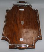 An Edwardian oak butler's tray