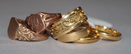 Two 22ct gold wedding bands, two 18ct gold rings and two 9ct gold rings.