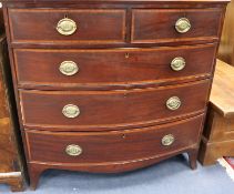 A Regency satinwood banded mahogany bow fronted chest of drawers 109cm