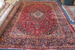A small Persian red ground carpet 330 x 240cm