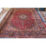 A small Persian red ground carpet 330 x 240cm