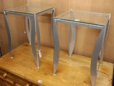 A pair of metal and glass bedside tables H.55.5cm